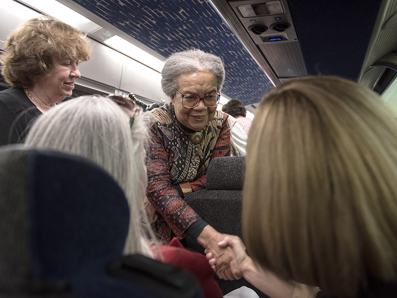 Edelman, center, greets  School of Nursing Dean Dr. Kim Hoover (right) and Dr. Janet Harris, School of Nursing associate dean for practice and community engagement, aboard a tour bus. Looking on is Dr. Lessa Phillips, former UMMC Department of Family Medicine chair and now chief medical officer of United Healthcare Community Plan Mississippi.